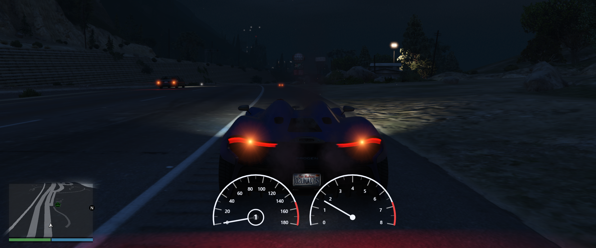 Analog dual-gauge speedometer and tachometer HUD overlaid on a Progen Furia driving a mountain road at night